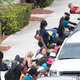 Image of people taking cover at Fort Lauderdale Airport on January 6 via AP
